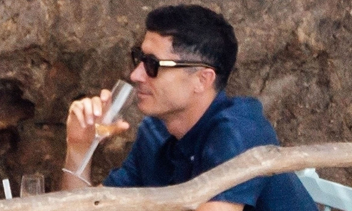 *EXCLUSIVE* The much sought after Polish Striker Robert Lewandowski seems to have puts all the speculation around his future behind him by taking things easy out on his holidays with his wife Anna in Mallorca.