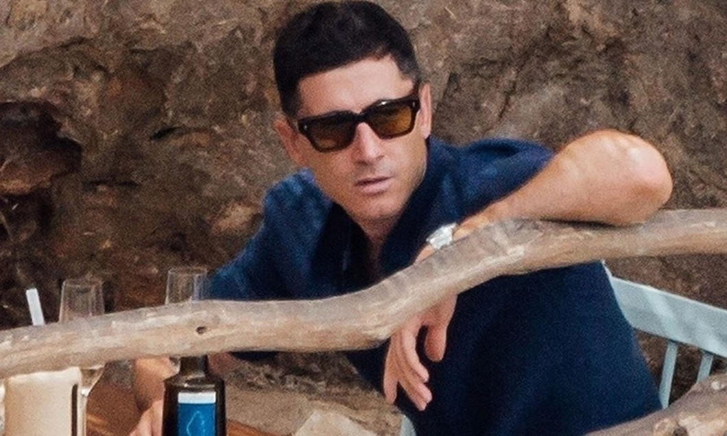 *EXCLUSIVE* The much sought after Polish Striker Robert Lewandowski seems to have puts all the speculation around his future behind him by taking things easy out on his holidays with his wife Anna in Mallorca.