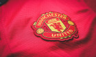 Manchester United. Logo embroidered on the T-shirt. Red Devil Football Club of England. Royal Football Club.