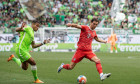 Wolfsburg, Germany. 14th May, 2022. Soccer: Bundesliga, VfL Wolfsburg - Bayern Munich, Matchday 34, Volkswagen Arena. Munich's Leon Goretzka (r) plays against Wolfsburg's Aster Vranckx. Credit: Swen Pfrtner/dpa - IMPORTANT NOTE: In accordance with the req