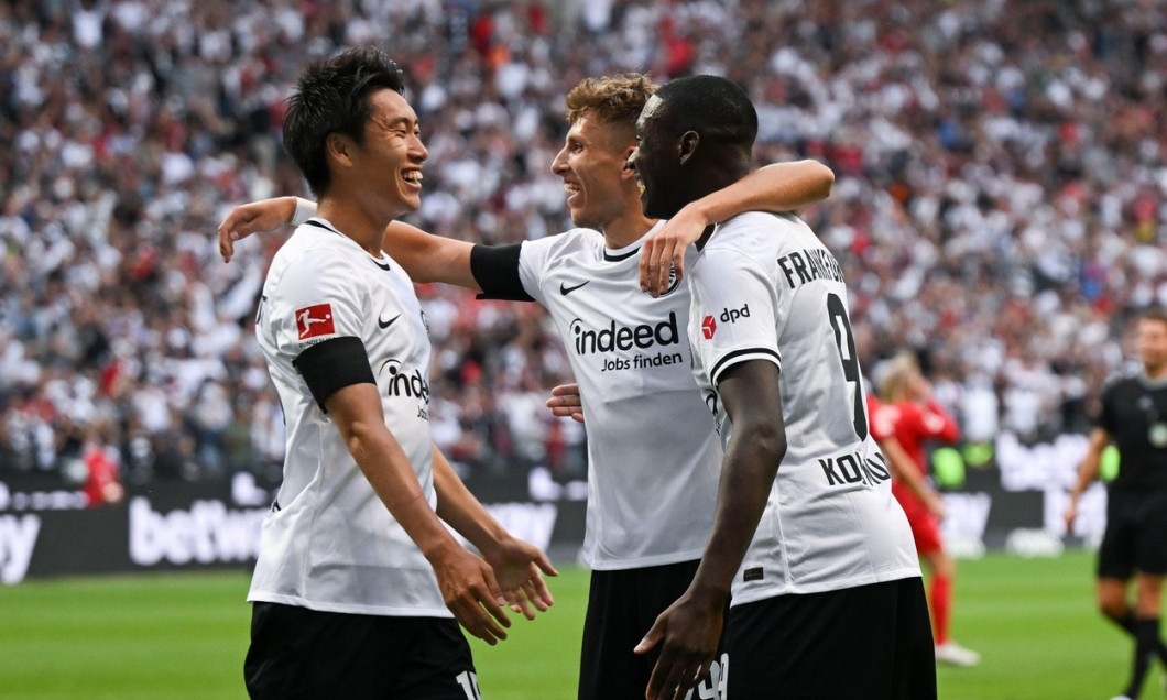 03 September 2022, Hessen, Frankfurt/Main: Soccer: Bundesliga, Eintracht Frankfurt - RB Leipzig, Matchday 5, at Deutsche Bank Park. Frankfurt's goal scorer Daichi Kamada (l-r), Jesper Lindstrm and Randal Kolo Muani cheer after the goal for 1:0. Photo: Arn