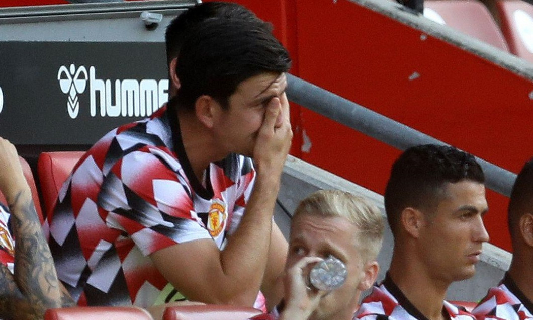 Southampton, England, 27th August 2022. Harry Maguire of Manchester United holds his head in hands as he sits on the subs bench during the Premier League match at St Mary's Stadium, Southampton. Picture credit should read: Paul Terry / Sportimage