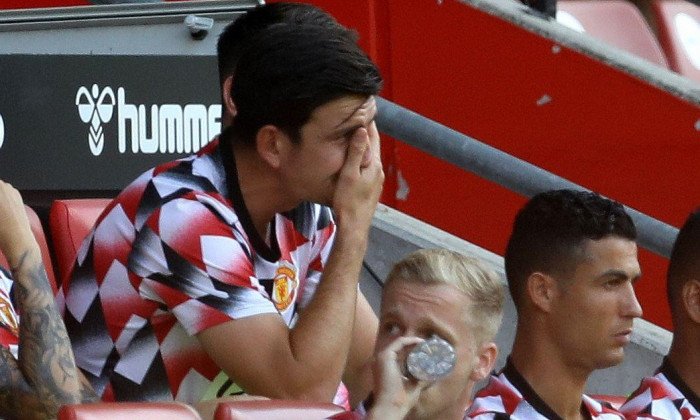 Southampton, England, 27th August 2022. Harry Maguire of Manchester United holds his head in hands as he sits on the subs bench during the Premier League match at St Mary's Stadium, Southampton. Picture credit should read: Paul Terry / Sportimage