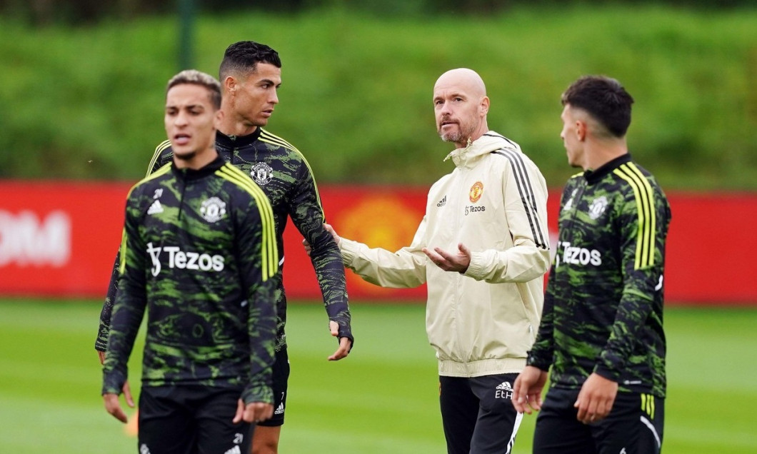 Manchester United's Cristiano Ronaldo speaks to manager Erik ten Hag during a training session at the Aon Training Complex, Greater Manchester. Picture date: Wednesday September 14, 2022.