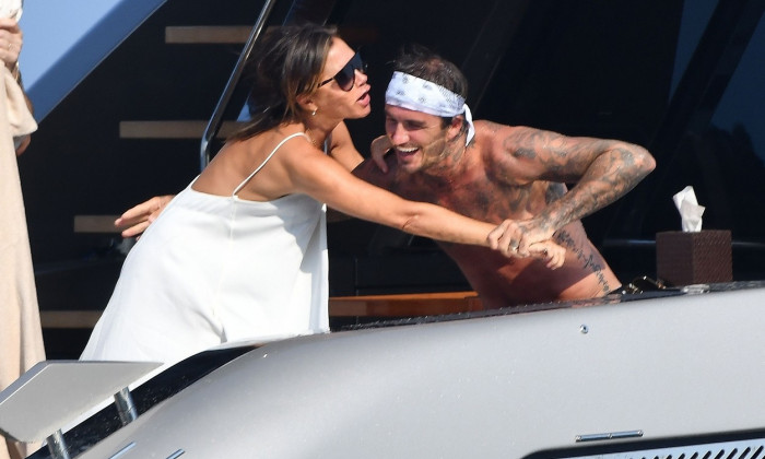 The Beckham Family pictured having fun with good friend Sir Elton John on board his mega Yacht in South of France