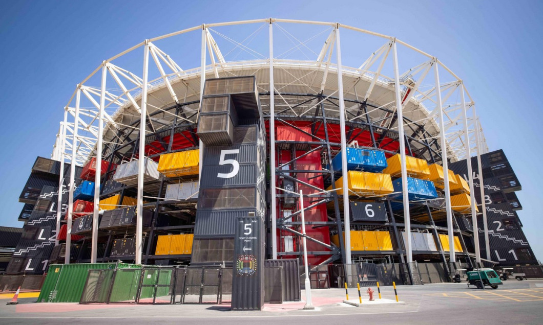 30 March 2022, Qatar, Doha: An exterior view shows the 974 stadium during a Fifa media tour. 974 colorfully arranged shipping containers were used to build the stadium. Doha will host the Fifa Congress on March 31 and the draw for the 2022 World Cup in Qa