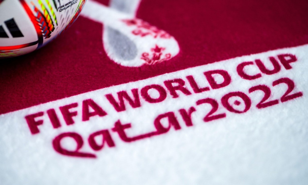QATAR, DOHA, 18 OCTOBER, 2022: Logo of FIFA World Cup in Qatar 2022 on red carpet. Soccer sport background, edit space. Qatar 22 Wallpaper. White edit