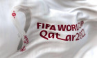 Doha, QA, October 2022: Detail of the FIFA Qatar 2022 World Cup white flag waving in the wind. The World Cup will take place in Qatar from 20 November