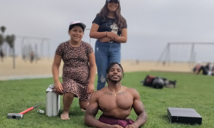 EXCLUSIVE: Strong Man Zion Clark An Inspirational Wrestler Plays With His Puppy At The Beach