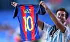 Barcelona fan shows Messi's shirt during the Joan Gamper Trophy match between Fc Barcelona and Juventus Fc . Fc Barcelona wins 3-0 over Juventus Fc.