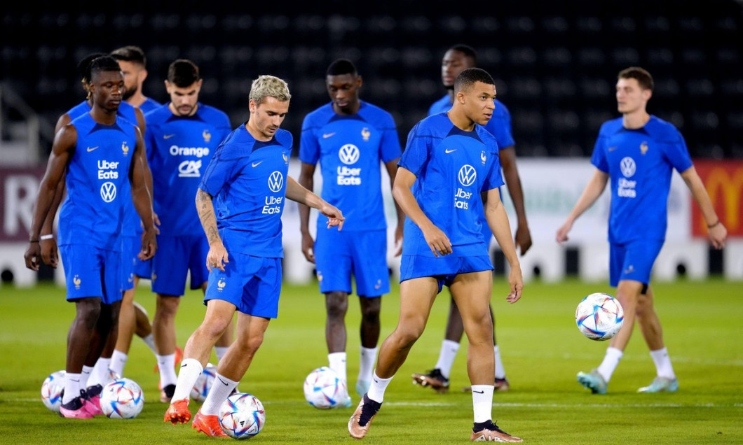 France's Antoine Griezmann (centre left) and Kylian Mbappe during a training session at the Al Sadd SC Stadium in Doha, Qatar. Picture date: Thursday December 8, 2022.