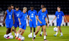 France's Antoine Griezmann (centre left) and Kylian Mbappe during a training session at the Al Sadd SC Stadium in Doha, Qatar. Picture date: Thursday December 8, 2022.