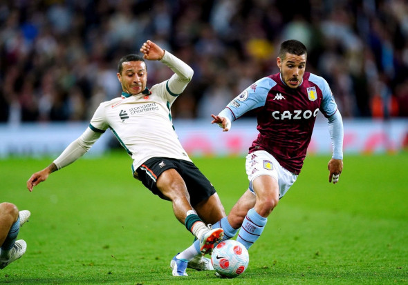 Liverpool's Thiago Alcantara (left) tackles Aston Villa's Emiliano Buendia during the Premier League match at Villa Park, Birmingham. Picture date: Tuesday May 10, 2022.