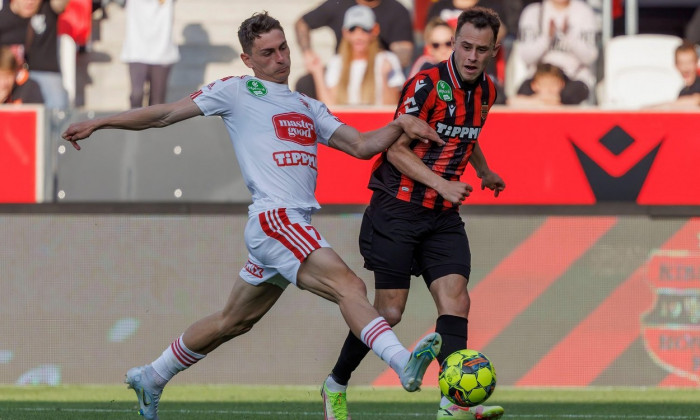 BUDAPEST, HUNGARY - APRIL 30: Andrei Peteleu of Kisvarda Master Good challenges Dejan Drazic of Budapest Honved during the Hungarian OTP Bank Liga match between Budapest Honved and Kisvarda Master Good at Bozsik Arena on April 30, 2022 in Budapest, Hungar