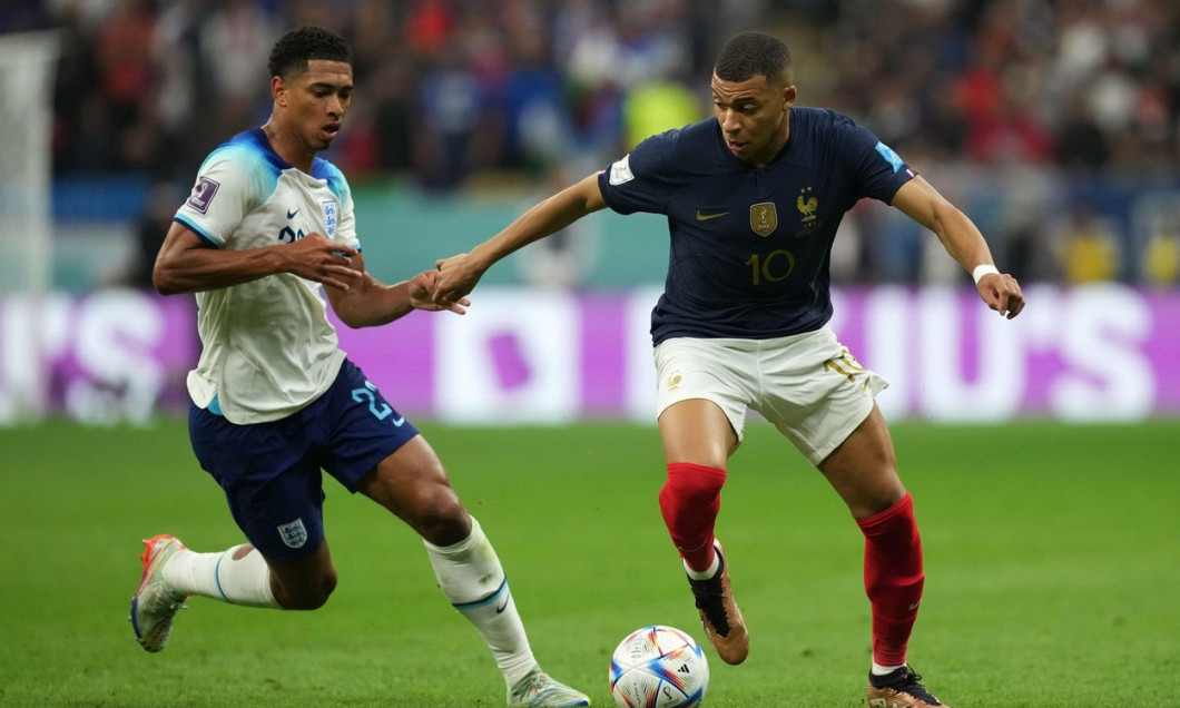 England's Jude Bellingham (left) and France's Kylian Mbappe battle for the ball during the FIFA World Cup Quarter-Final match at the Al Bayt Stadium in Al Khor, Qatar. Picture date: Saturday December 10, 2022.