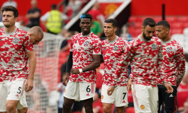 Manchester United players including Paul Pogba (centre left) and Cristiano Ronaldo (centre right) on the pitch during the warm up before the Premier League match at Old Trafford, Manchester. Picture date: Saturday September 25, 2021.