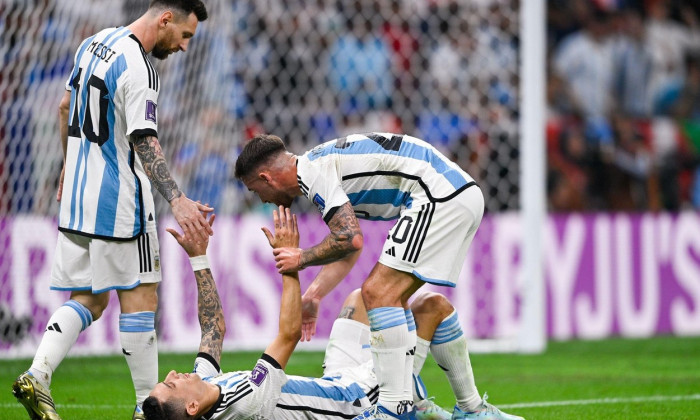 LUSAIL CITY, QATAR - DECEMBER 18: Angel Di Maria of Argentina interacts with Alexis Mac Allister of Argentina and Lionel Messi of Argentina during the Final - FIFA World Cup Qatar 2022 match between Argentina and France at the Lusail Stadium on December 1