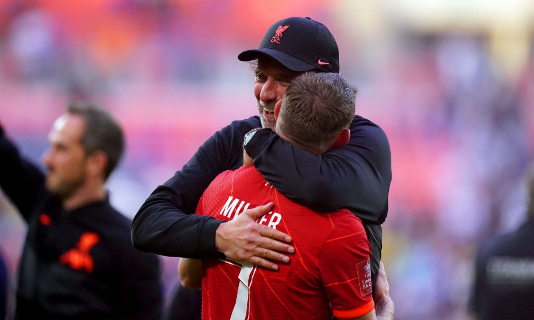 Liverpool manager Jurgen Klopp hugs James Milner as they celebrate winning the Emirates FA Cup final at Wembley Stadium, London. Picture date: Saturday May 14, 2022.