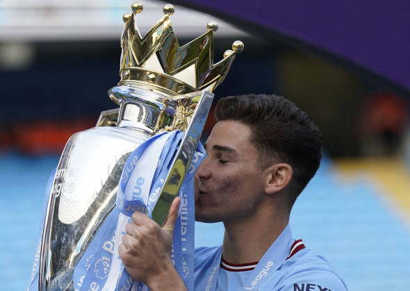 Manchester, England, 21st May 2023. Julian Alvarez of Manchester City with the Premier League Trophy during the Premier