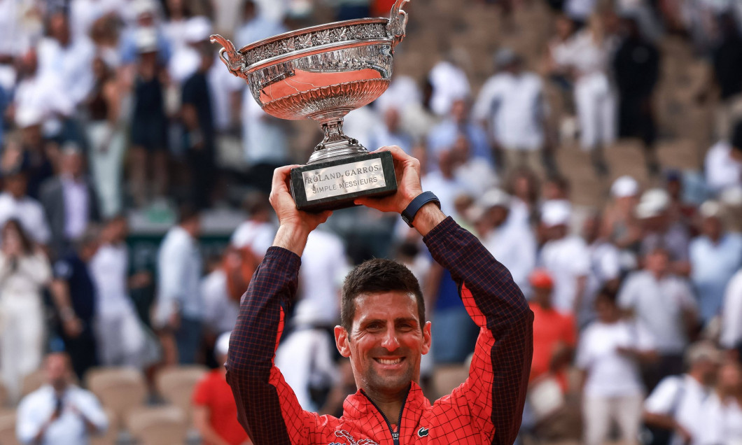 Serbia s Novak Djokovic raises the trophy Des Mousquetaires following his victory against Norway s Casper Ruud during th