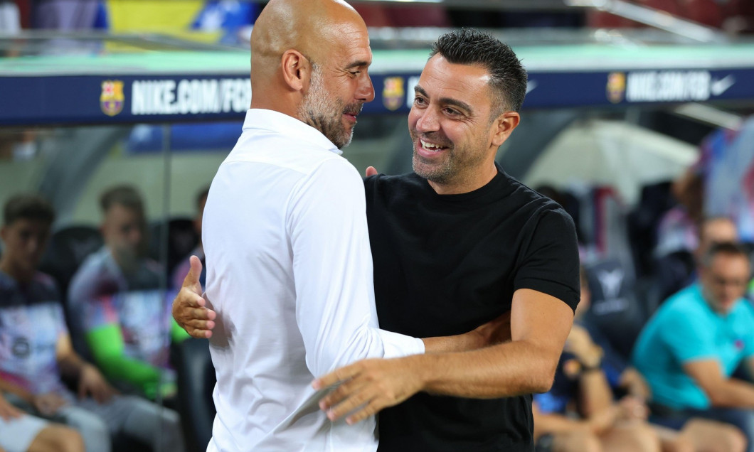 Barcelona, Spain. 24th Aug, 2022. Pep Guardiola of Manchester City with Xavi Hernandez of FC Barcelona during the benefic friendly match to raise funds for ELA between FC Barcelona and Manchester City at Spotify Camp Nou in Barcelona, Spain. Credit: DAX I