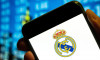 In this photo illustration, the Spanish professional football club team Real Madrid Club de Ftbol commonly known as Real Madrid logo is displayed on a smartphone screen.
