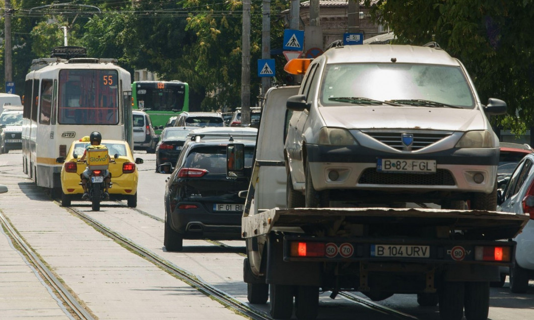 Bucharest, Romania - August 04, 2022: Cars in traffic at rush hour on a boulevard in Bucharest.