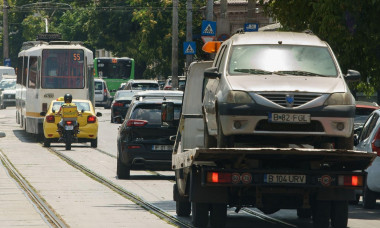 Bucharest, Romania - August 04, 2022: Cars in traffic at rush hour on a boulevard in Bucharest.