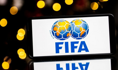 In this photo illustration a FIFA logo seen displayed on a smartphone.