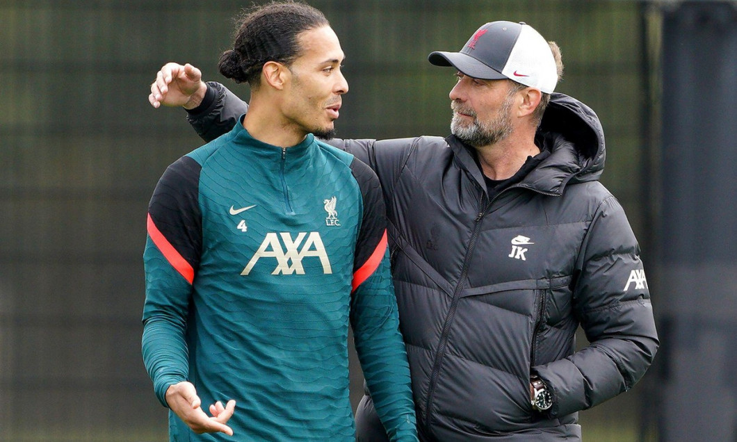Liverpool's Virgil van Dijk (left) and manager Jurgen Klopp during a media day at the AXA Training Centre in Liverpool ahead of the UEFA Champions League Final in Paris on Saturday. Picture date: Wednesday May 25, 2022.