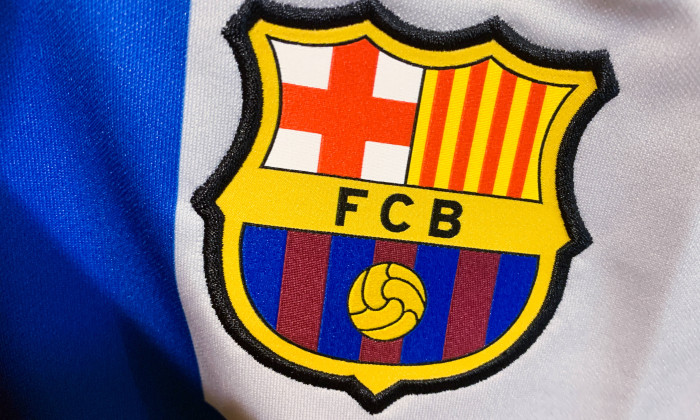 Football Emblems And Logos FC Barcelona logo is seen on a football jersey in this illustration photo taken in a store in