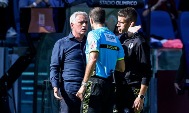 Rome, Italy. 22nd Oct, 2023. Jose Mourinho, left, head coach of AS Roma, argues with referee Giovanni Ayroldi, center, and fourth assistant Antonio Giua during the Italian Serie A championship football match between Roma and Monza at the Olympic Stadium,