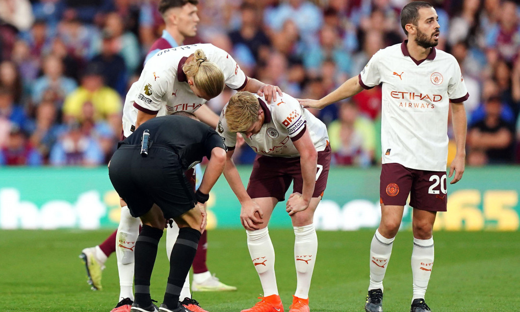 Manchester City's Kevin De Bruyne (centre) with his hands on his knees after picking up a possible injury during the Premier League match at Turf Moor, Burnley. Picture date: Friday August 11, 2023.