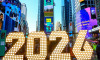 New York, USA. 18th May, 2023. People watch billboards displaying the official logos for the FIFA World Cup 2026 New York/New Jersey at a launch Event in Times Square. The event unveiled the official themes for the MetLife stadium matches: "We are NYNJ" a