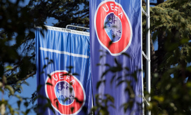 Nyon, Switzerland. 26th Sep, 2018. Flags with the UEFA logo waft in the garden of the headquarters of the Union of European Football Associations on Lake Geneva. The decision on the host of the continental tournament in 2024 will be made by the members of