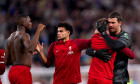 Liverpool goalkeeper Alisson Becker hugs a team-mate at the end of the Premier League match at Tottenham Hotspur Stadium, London. Picture date: Saturday September 30, 2023.