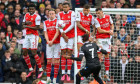 London, UK. 19th Mar, 2023. 19 Mar 2023 - Arsenal v Crystal Palace - Premier League - Emirates Stadium Crystal Palace's Michael Olise fires in a free kick defended by Granit Xhaka, Thomas Partey, Ben White, Gabriel Magalhaes and Rob Holding. Picture Credi
