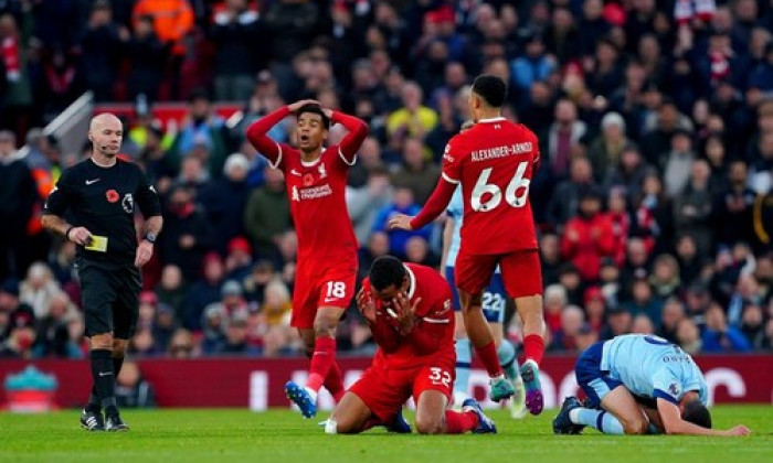 Liverpool's Joel Matip reacts after being shown a yellow card during the Premier League match at Anfield, Liverpool. Picture date: Sunday November 12, 2023.