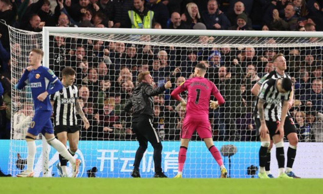 London, England, 19th December 2023. A fan runs onto the pitch and gets very close to Martin Dubravka of Newcastle Unite