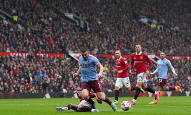 Manchester United's Tyrell Malacia makes a tackle on Aston Villa's John McGinn during the Premier League match at Old Trafford, Manchester. Picture date: Sunday April 30, 2023.