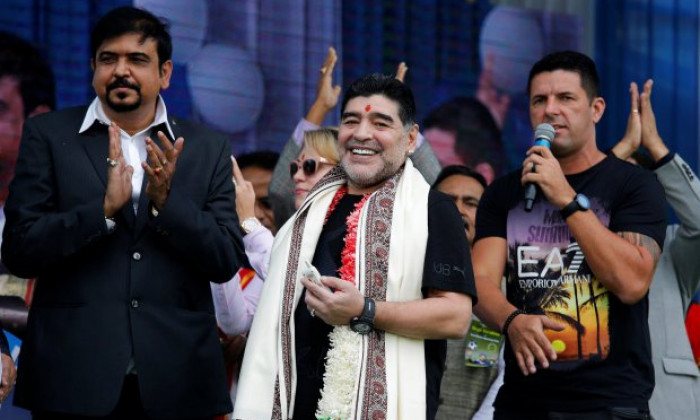 Argentina's soccer legend Diego Maradona smiles as he attends a charity event for cancer-affected patients in Kolkata