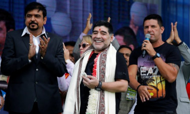 Argentina's soccer legend Diego Maradona smiles as he attends a charity event for cancer-affected patients in Kolkata