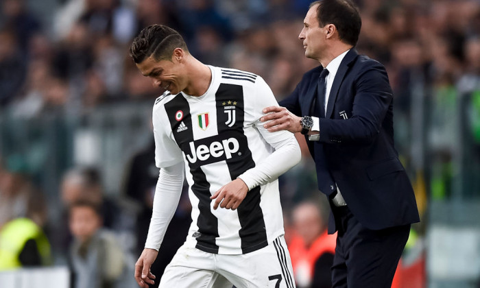 Massimiliano Allegri (R), head coach of Juventus FC, holds