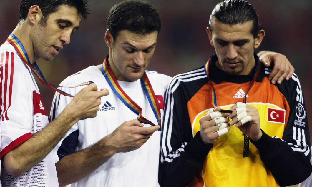 Hakan Sukur, Alpay Ozalan and Rustu Recber of Turkey with medals