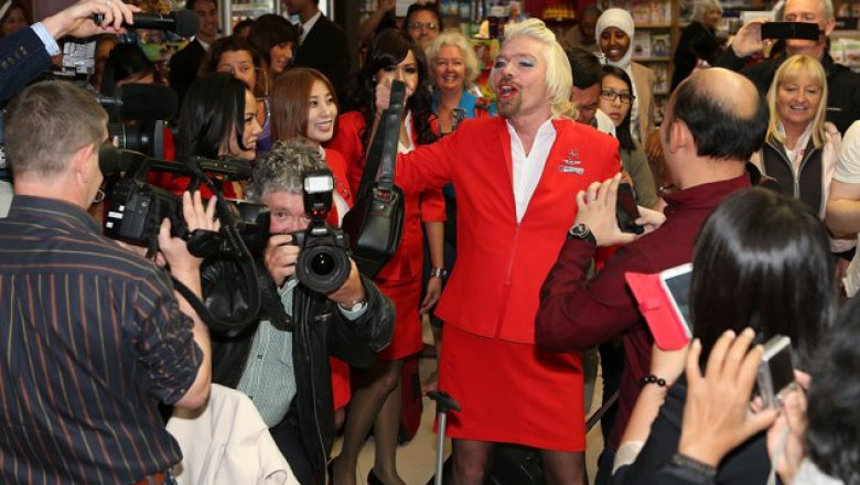 stewardess-richard-branson-serves-passengers-20130511-174232-152