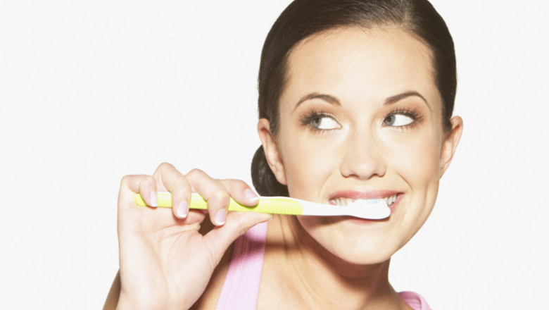 woman-brushing-teeth 1