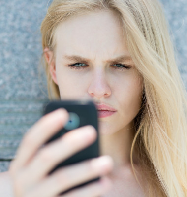 Upset,Woman,Holding,A,Cellphone.