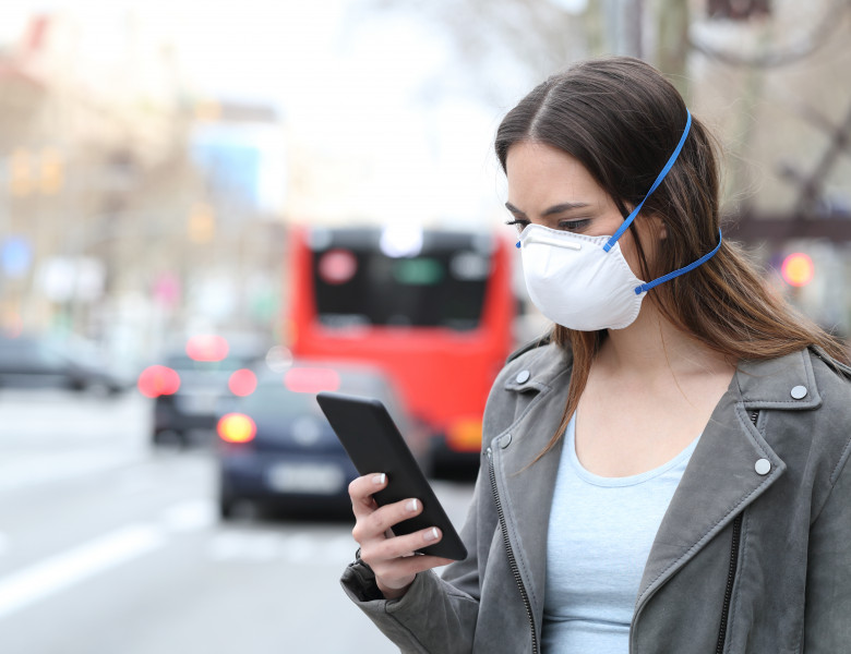 Woman,With,Protective,Mask,Avoiding,Pollution,Using,Smart,Phone,With