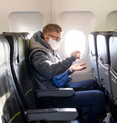 Guy,In,Airplane,,Young,Man,In,Glasses,,Medical,Protective,Sterile
