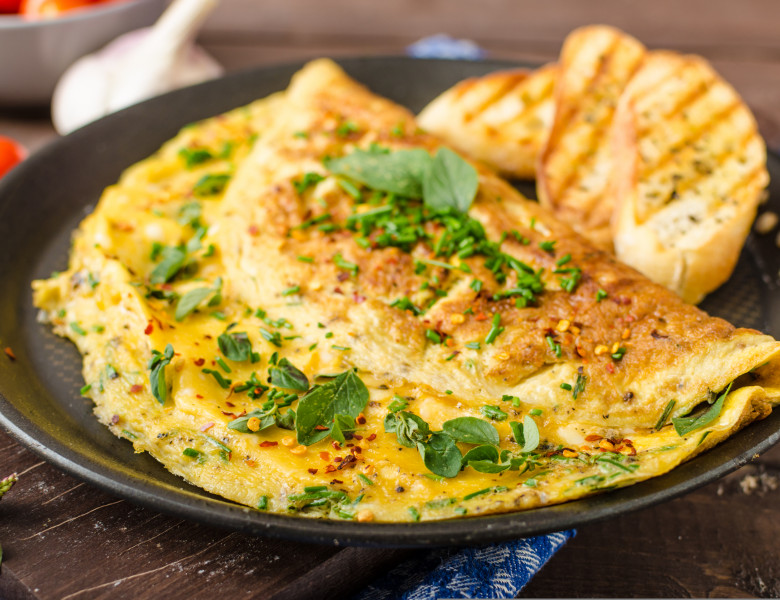 Herb,Omelette,With,Chives,And,Oregano,Sprinkled,With,Chili,Flakes,